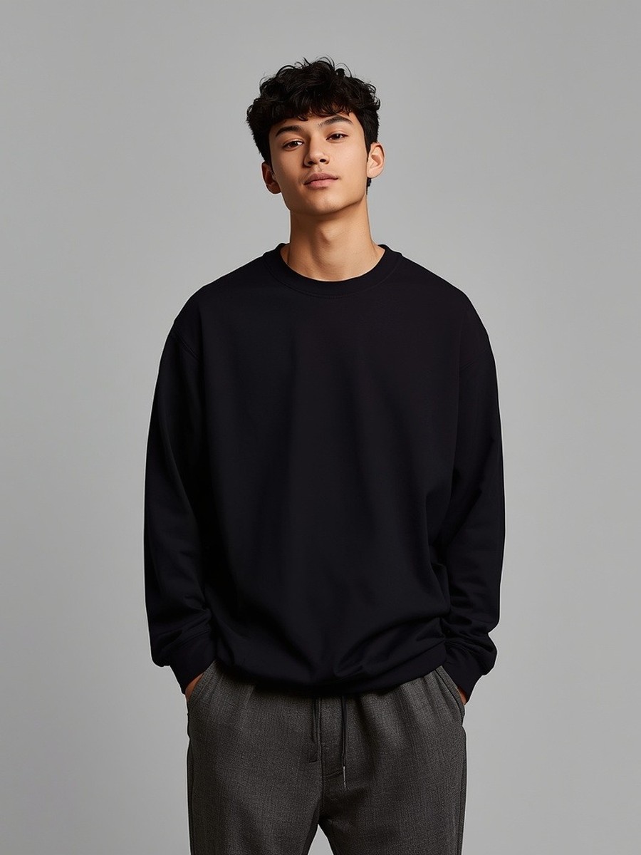 Dopameez cast — plain black crewneck, minimal studio portrait