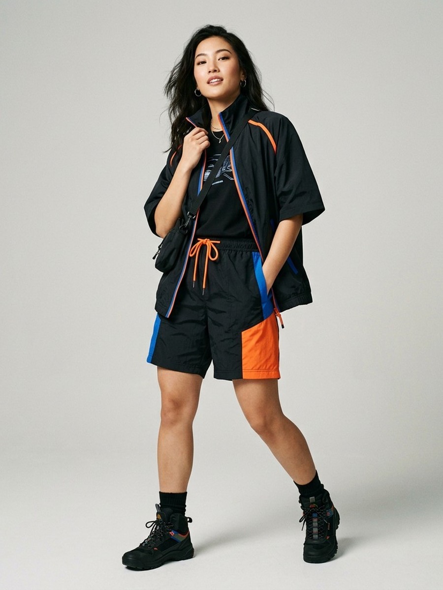Dopameez cast — colour-blocked windbreaker set in black, blue and orange